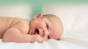 Happy smiling baby image for Amazing baby facts article on Babies And Children