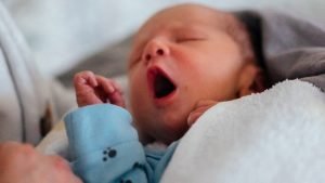 Babies and Children article on how to help your baby sleep - picture of baby yawning