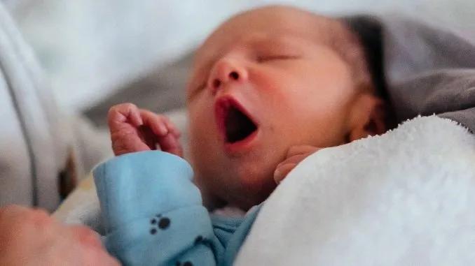 Babies and Children article on how to help your baby sleep - picture of baby yawning