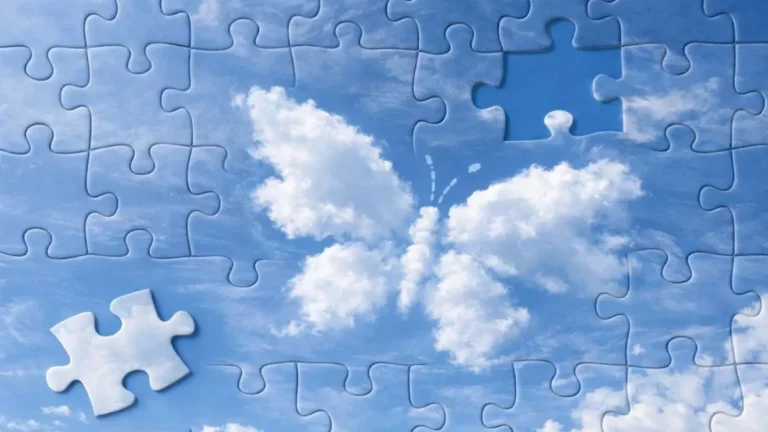 Clouds forming a jigsaw puzzle in the sky, with one piece missing and a butterfly shape emerging.